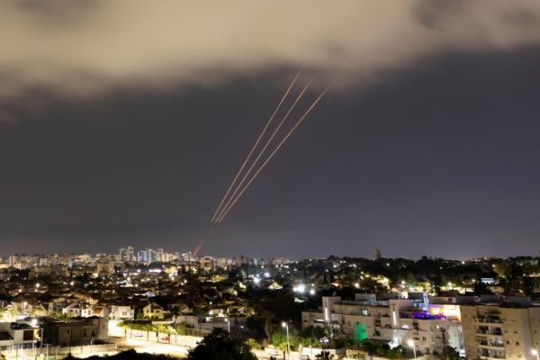 An anti-missile system operates after Iran launched dro<em></em>nes and missiles towards Israel